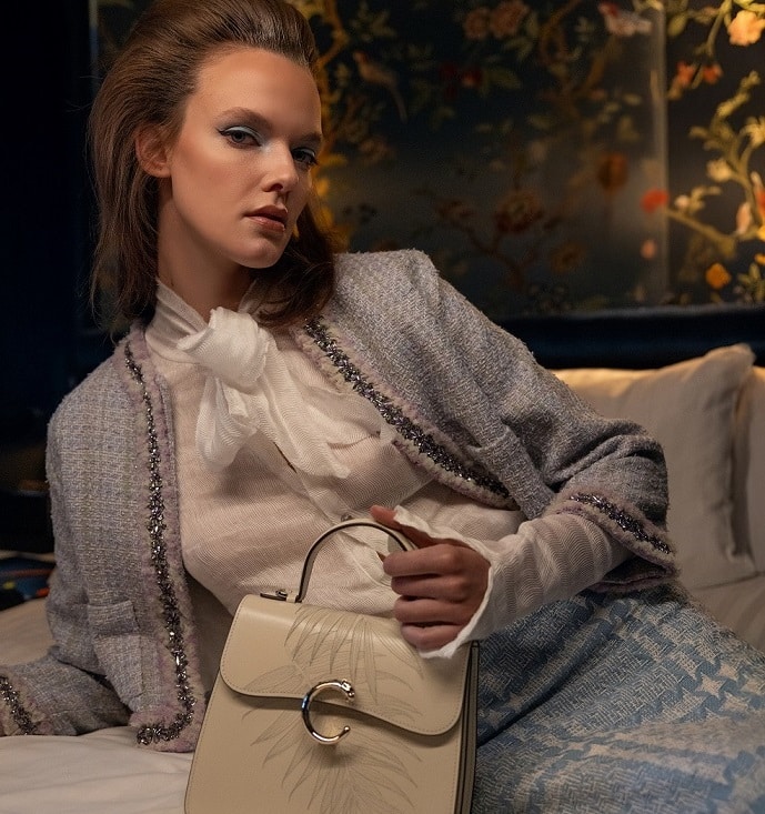 Paris at night: a beautiful woman and a Cartier bag